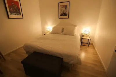 Un ou plusieurs lits dans un hébergement de l'établissement Le St Ausone : Studio Centre Ville/parking