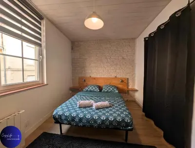 Un ou plusieurs lits dans un hébergement de l'établissement Le Paul by CozyLife - Centre Ville - Gare