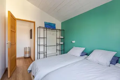 Un ou plusieurs lits dans un hébergement de l'établissement Maison à 10’ à pieds du port de La Rochelle