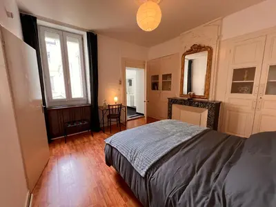 Un ou plusieurs lits dans un hébergement de l'établissement La Colbertine - Charming Apartment in Place Colbert