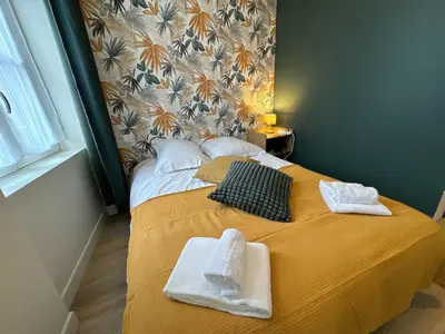Un ou plusieurs lits dans un hébergement de l'établissement La Maison D'Oscar