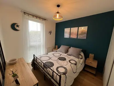 Un ou plusieurs lits dans un hébergement de l'établissement Appartement cosy au calme avec jardin et parking