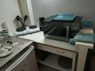 Cuisine ou kitchenette dans l'établissement Studio meublé 27 mètres carrés wifi netflix