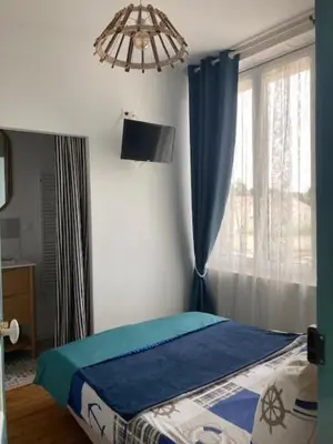 Un ou plusieurs lits dans un hébergement de l'établissement Les chambres du Phare - 3 chambres