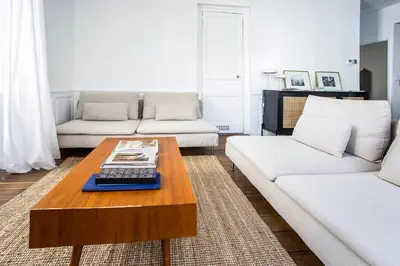 Coin salon dans l'établissement Appartement entier avec place de parking