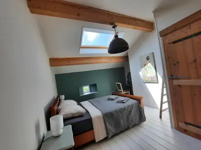 Un ou plusieurs lits dans un hébergement de l'établissement Gîte La Boutardière