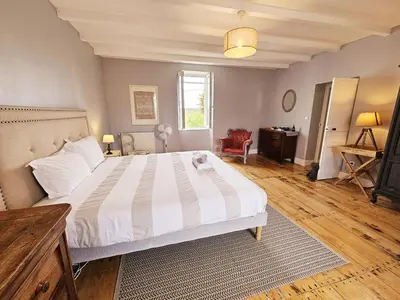 Un ou plusieurs lits dans un hébergement de l'établissement La spacieuse maison des miots