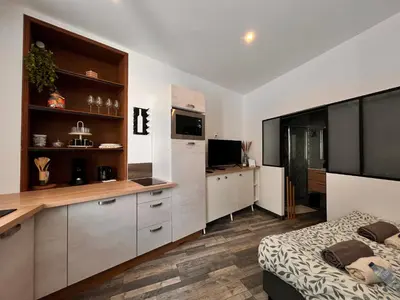 Cuisine ou kitchenette dans l'établissement Cocooning à cognac