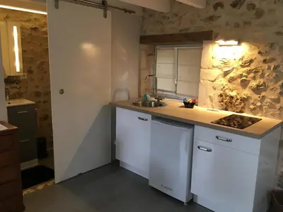 Cuisine ou kitchenette dans l'établissement Au cœur du jardin
