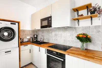 Cuisine ou kitchenette dans l'établissement Cosy appart proche du marché