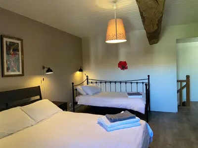 Un ou plusieurs lits dans un hébergement de l'établissement La Maison des Coteaux
