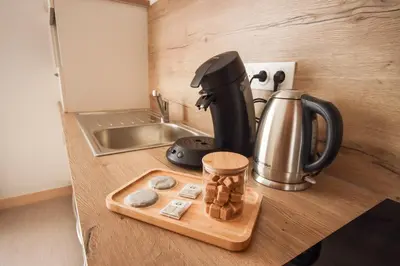 Cuisine ou kitchenette dans l'établissement L'Eco Studio - Vue Panoramique