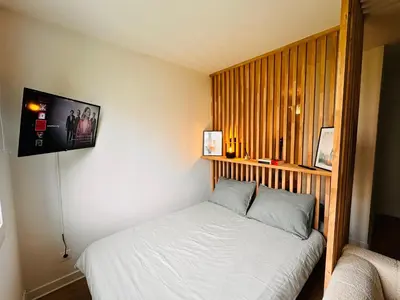 Un ou plusieurs lits dans un hébergement de l'établissement Appartement Bird II proche centre gare, parking