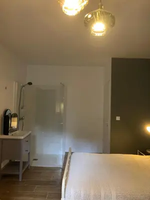 Un ou plusieurs lits dans un hébergement de l'établissement Chambre d’hôtes