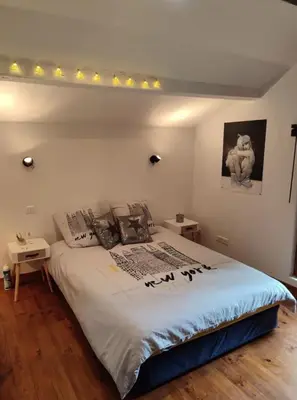 Un ou plusieurs lits dans un hébergement de l'établissement Jolie chambre d'hôtes