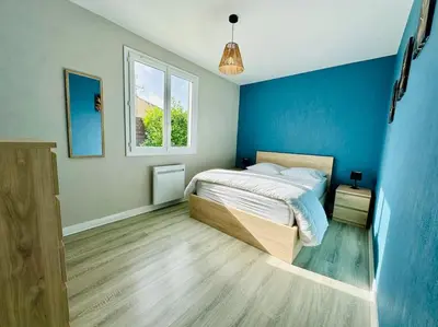 Un ou plusieurs lits dans un hébergement de l'établissement Au petit bonheur - Maison familiale au calme