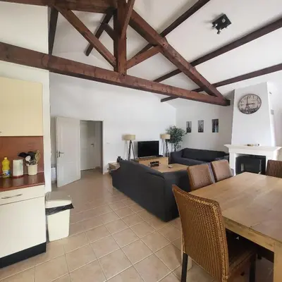 Coin salon dans l'établissement Charmante maison de vacances - Domaine les Forges