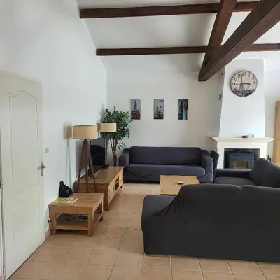 Coin salon dans l'établissement Charmante maison de vacances - Domaine les Forges