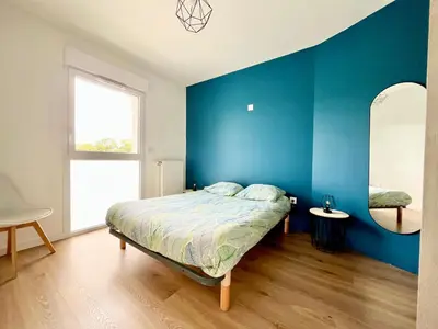 Un ou plusieurs lits dans un hébergement de l'établissement Superbe appartement extérieur, 2 chambres, parking