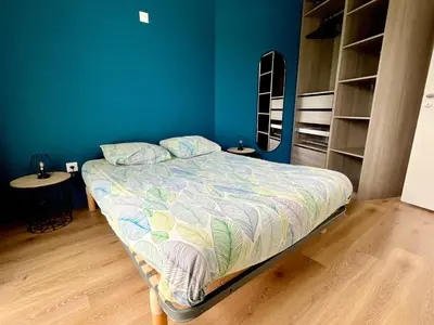 Un ou plusieurs lits dans un hébergement de l'établissement Superbe appartement extérieur, 2 chambres, parking