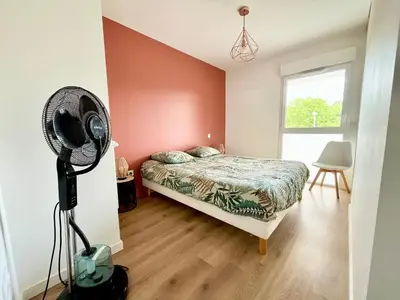 Un ou plusieurs lits dans un hébergement de l'établissement Superbe appartement extérieur, 2 chambres, parking