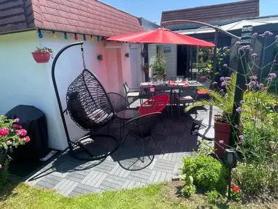 Jardin de l'établissement Charmante maison pour vos vacances