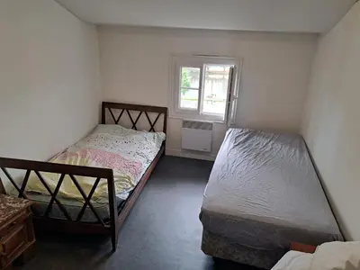Un ou plusieurs lits dans un hébergement de l'établissement Duplex vue dégagée sur le vieux Saintes