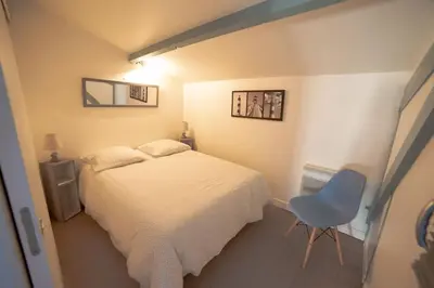 Un ou plusieurs lits dans un hébergement de l'établissement Maison type Loft - avec parking en plein centre
