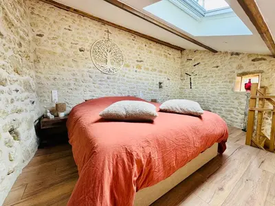 Un ou plusieurs lits dans un hébergement de l'établissement Le gîte 24 proche du Futuroscope - Jacuzzi compris