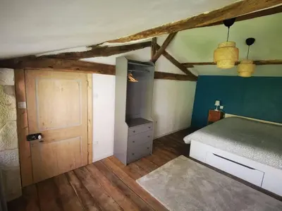 Un ou plusieurs lits dans un hébergement de l'établissement Gîte chaleureux à Cherveux