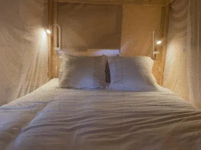 Un ou plusieurs lits dans un hébergement de l'établissement LODGE Champêtre Glamping