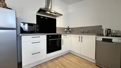 Cuisine ou kitchenette dans l'établissement Futurostudio - 4 saisons Standing - 5min Futuroscope - Parking