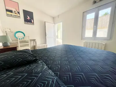 Un ou plusieurs lits dans un hébergement de l'établissement Charmante Maison Fourasine Centre-ville Jardin