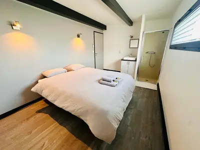 Un ou plusieurs lits dans un hébergement de l'établissement L'Escapade - Villa avec piscine