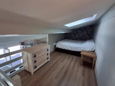 Un ou plusieurs lits dans un hébergement de l'établissement Appartement cosy avec mezzanine, proche plage et commerces - Châtelaillon-Plage - FR-1-706-29