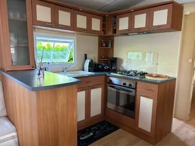 Cuisine ou kitchenette dans l'établissement Mobil Home Bord de Mer