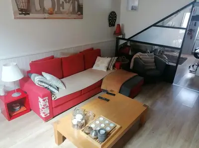 Coin salon dans l'établissement Maison de vacances