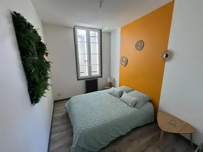 Un ou plusieurs lits dans un hébergement de l'établissement Le petit jardin de Bellune