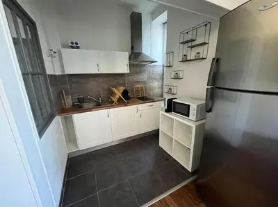 Cuisine ou kitchenette dans l'établissement Le petit jardin de Bellune