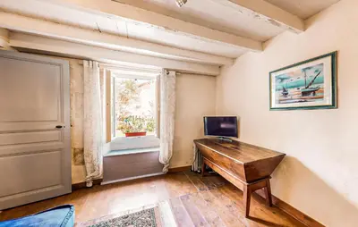 Télévision ou salle de divertissement dans l'établissement Gîte Au Naturel