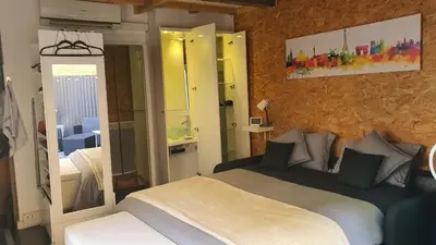 Un ou plusieurs lits dans un hébergement de l'établissement Studio du 44