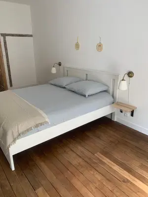 Un ou plusieurs lits dans un hébergement de l'établissement Appart à Mémé 2 chambres