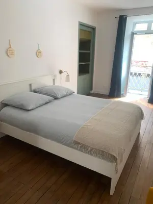 Un ou plusieurs lits dans un hébergement de l'établissement Appart à Mémé 2 chambres