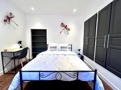 Un ou plusieurs lits dans un hébergement de l'établissement Le Puyravault - Studio situé en plein centre-ville & proche des thermes