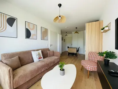 Coin salon dans l'établissement T2 neuf quartier Vieux Port avec ascenseur et terrasse