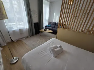Un ou plusieurs lits dans un hébergement de l'établissement G2 Appartement Familial lumineux RDC centre Angouleme