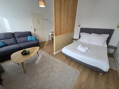 Un ou plusieurs lits dans un hébergement de l'établissement G2 Appartement Familial lumineux RDC centre Angouleme