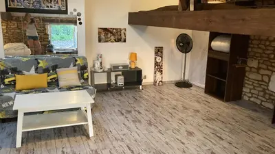 Coin salon dans l'établissement Chambre chez l'habitant, Au moulin du Bonheur