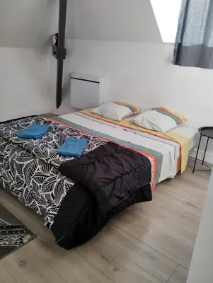 Un ou plusieurs lits dans un hébergement de l'établissement Chambres chez l'habitant proche sortie A10