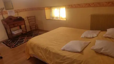 Un ou plusieurs lits dans un hébergement de l'établissement Chambres d'hôtes entre Niort et Marais Poitevin